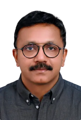 Dr. Tenison Chacko